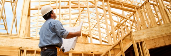 Man Inspecting building for Permit expediting